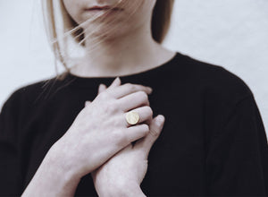 Hand forged gold disc ring